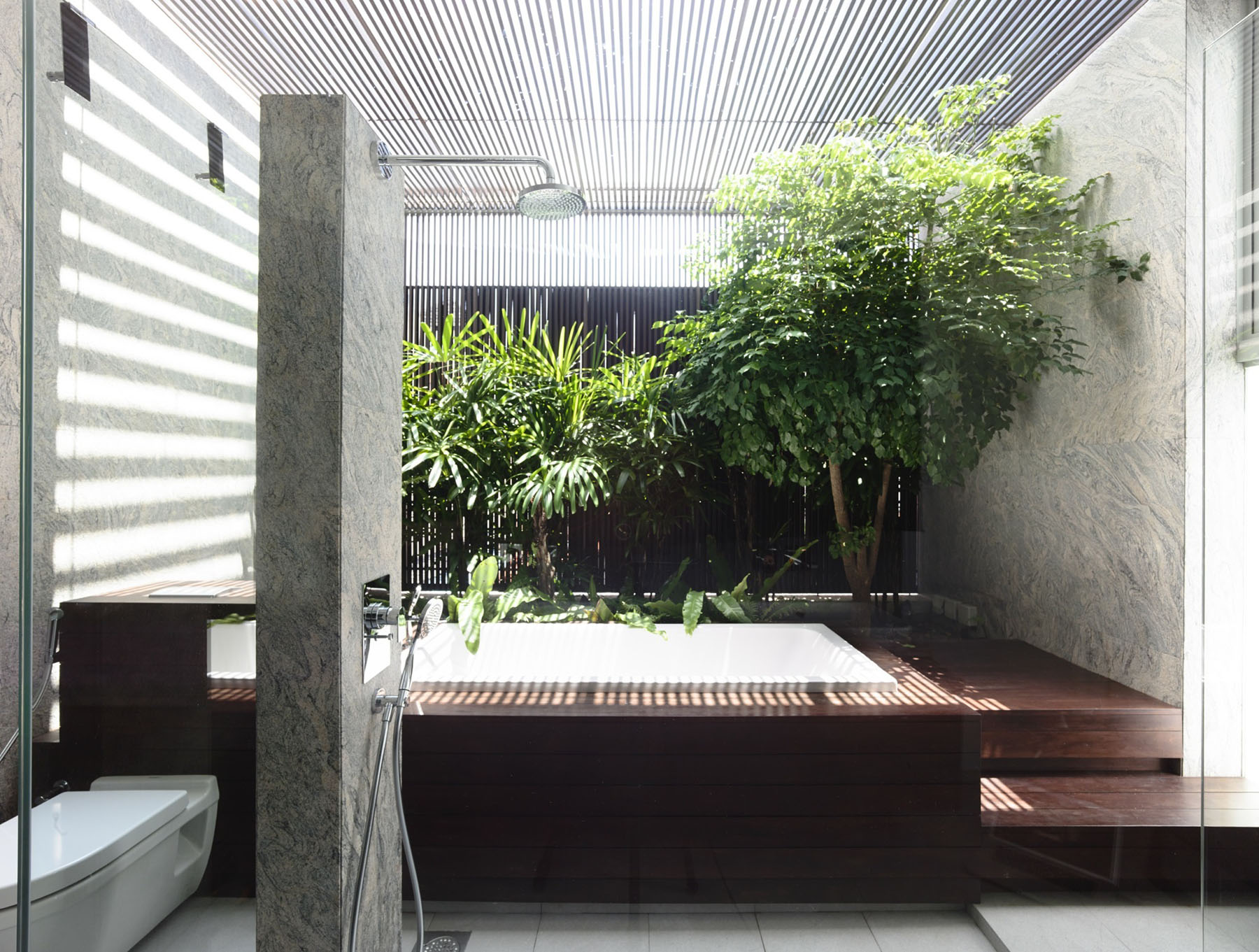 Sleek modern home in singapore with glass bridge over pool ...