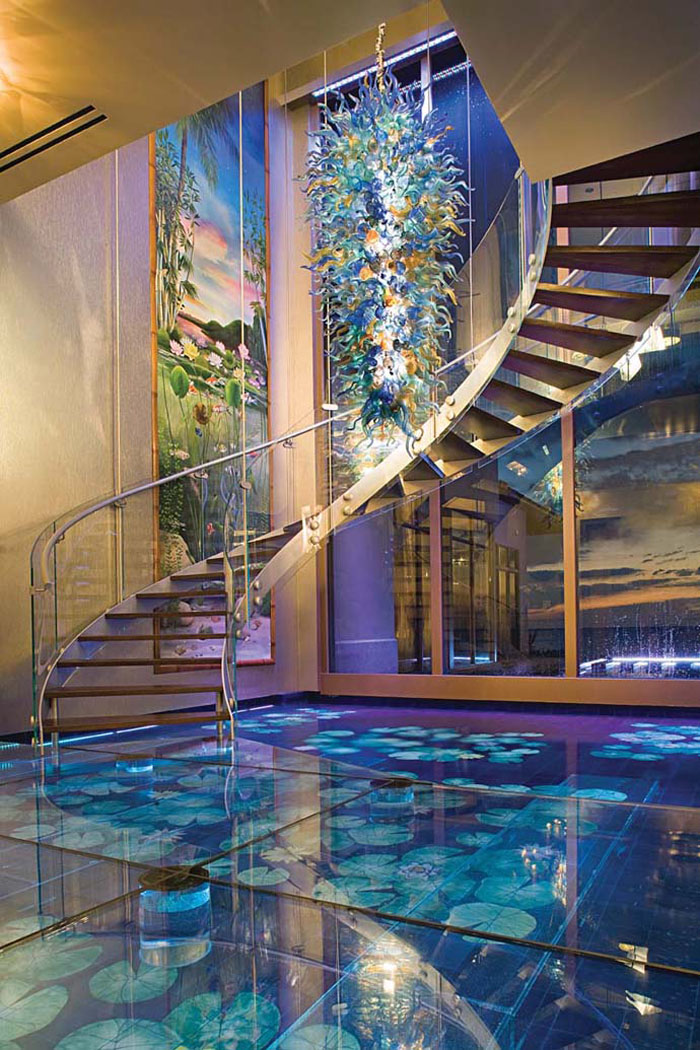 Double helix glass spiral staircase and hand-blown glass chandelier