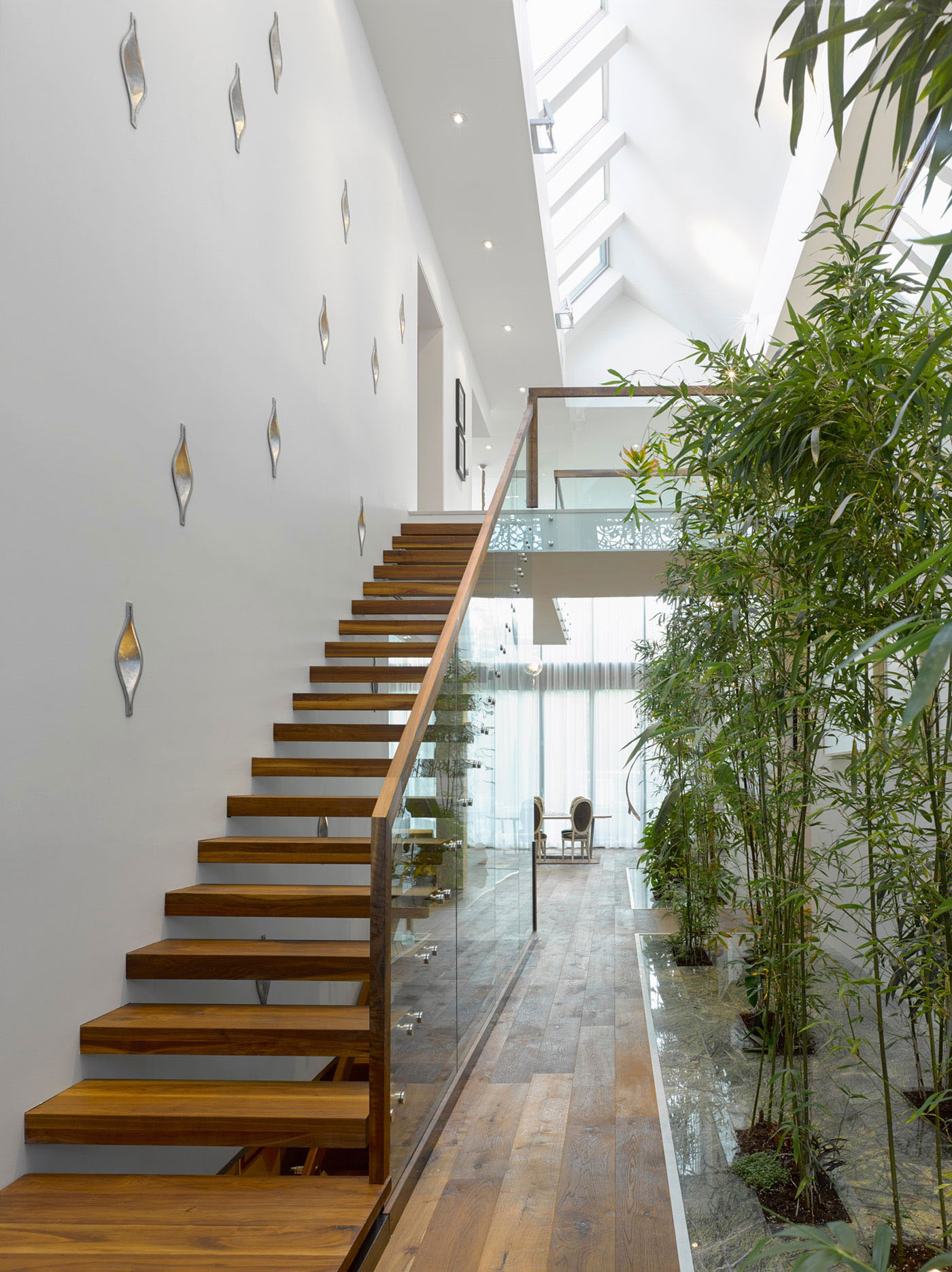 Atrium with Glass Staircase and Bamboo Garden