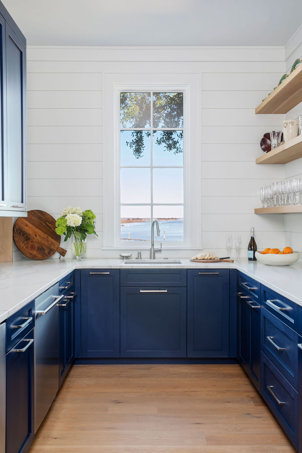 Pantry with a View. Blue Kitchen Cabinet with Marble Countertop