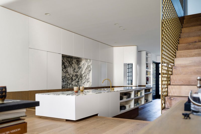 Modern White Kitchen with Carrara Marble Countertop and Backsplash