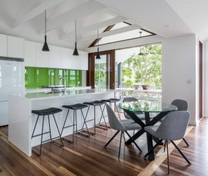 Modern Renovated White Kitchen with Green Backsplash