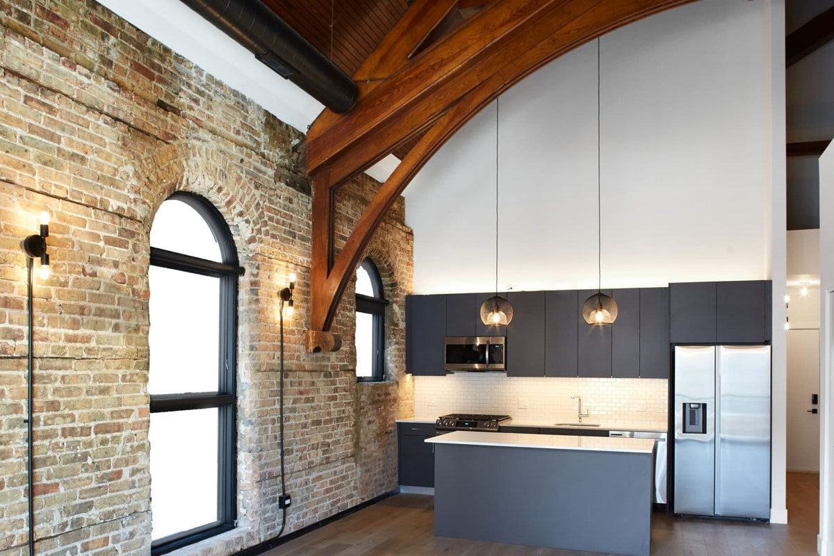 Modern Loft Kitchen with Rustic Wooden Trusses