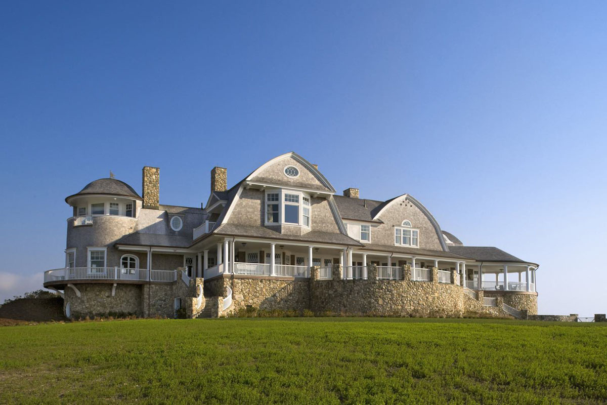 Shingle-Style Home with Gambrel Roof and Covered Porch