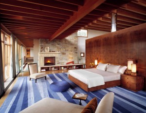 Bedroom with Wood Beams and Stone Wall