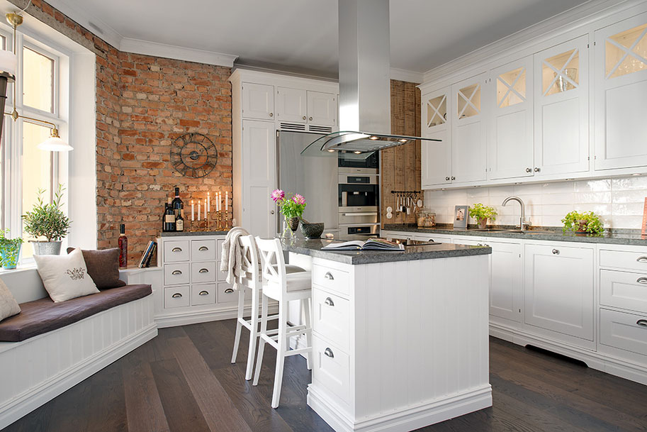 Modern White Kitchen with Brick Wall