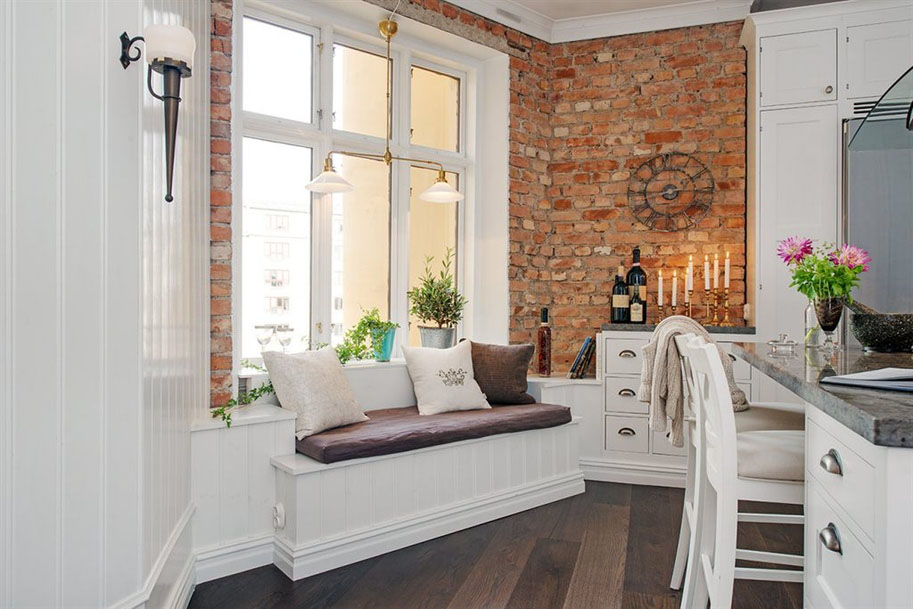 Cozy Kitchen with Seating Bench and Brick Wall