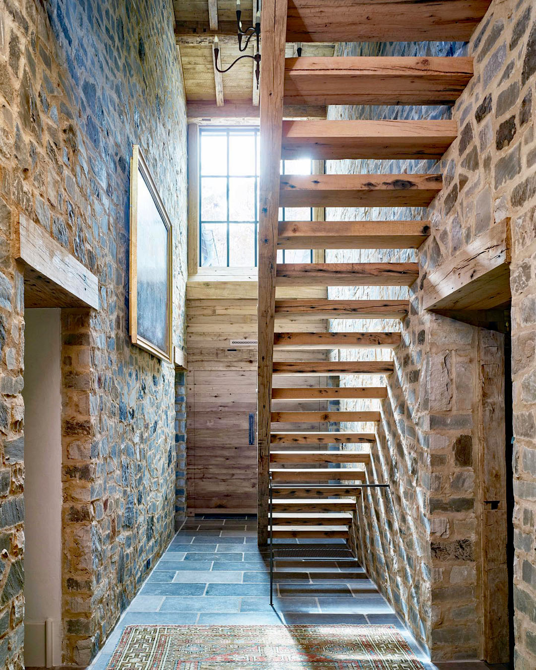 Wooden Staircase Against Rustic Stone Walls