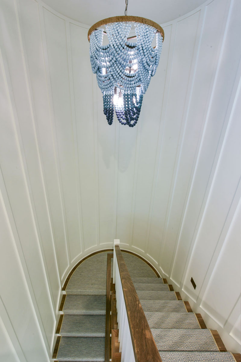 Staircase with White Board and Batten Curved Wall