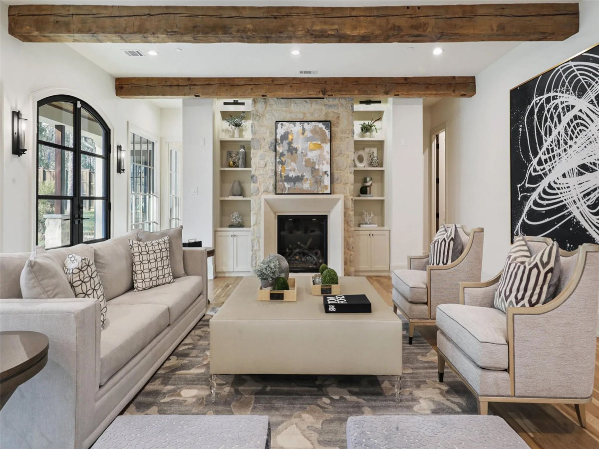 Contemporary Living Room with Rustic Stone Fireplace and Reclaimed Wood Beams