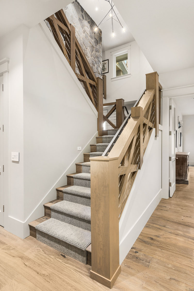 Modern Rustic Wood Staircase with Stone Wall