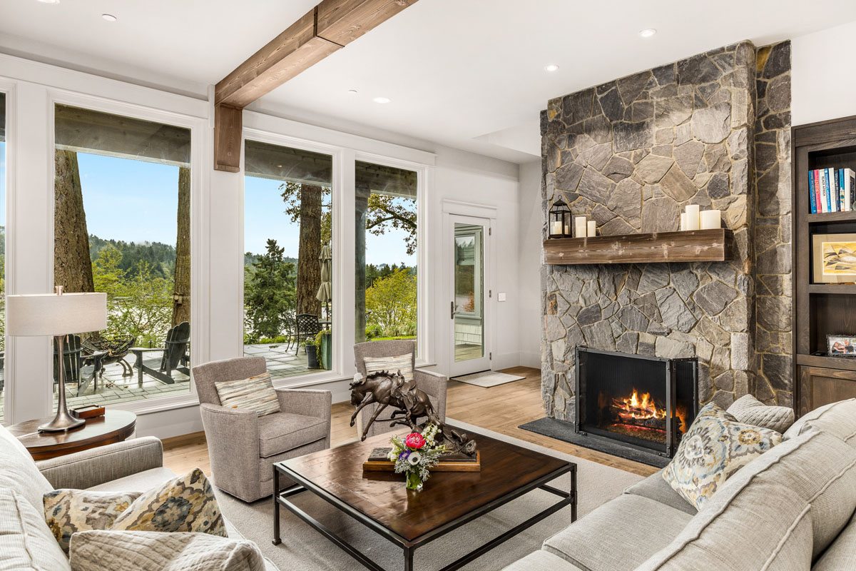 Modern Living Room with Rustic Stone Fireplace and Wood Beams