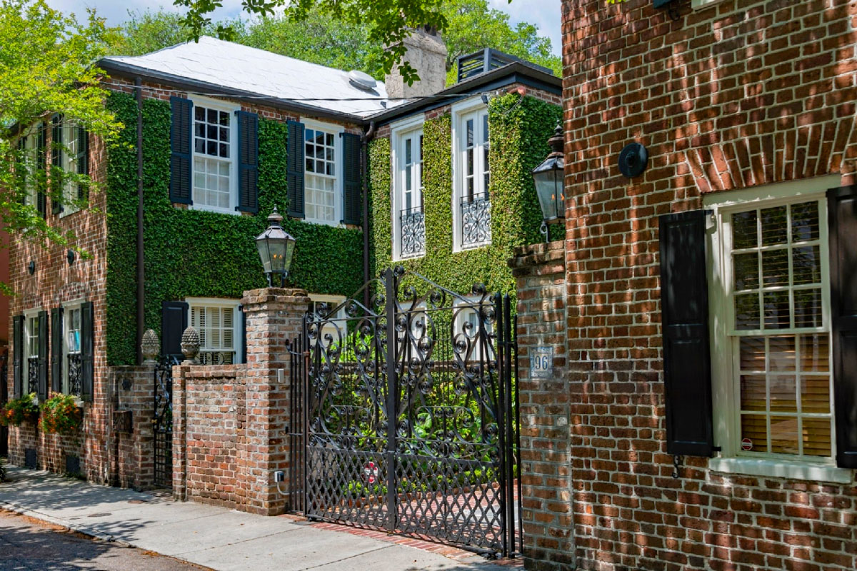 Old Town Brick House with Black Shutters and Flower Boxes