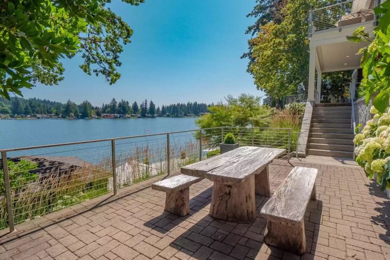 Beach Style Waterfront Home with Boathouse on Oswego Lake