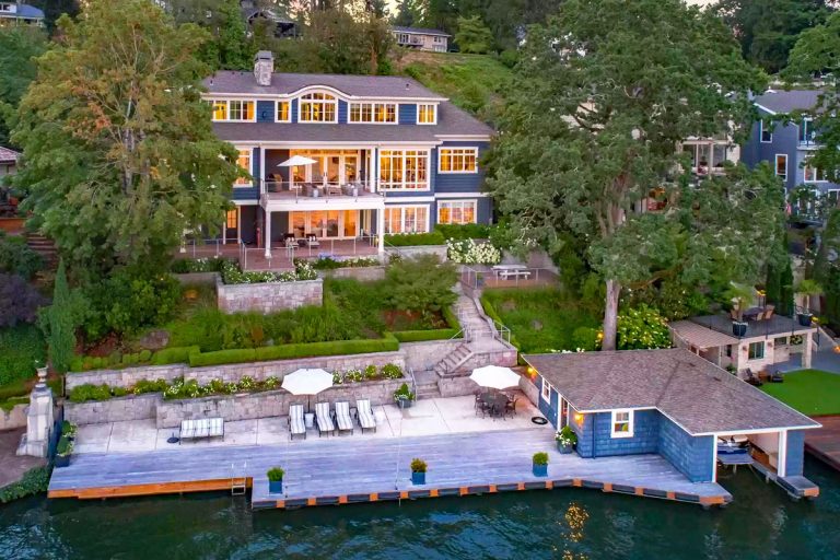 Beach Style Waterfront Home with Boathouse on Oswego Lake