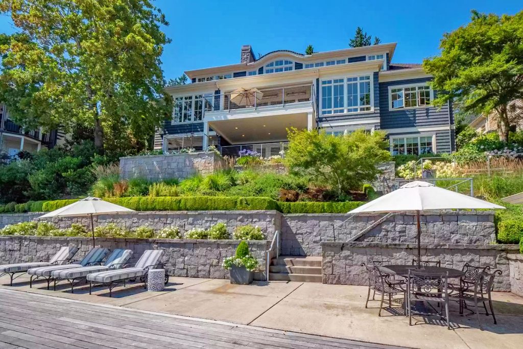 Beach Style Waterfront Home with Boathouse on Oswego Lake