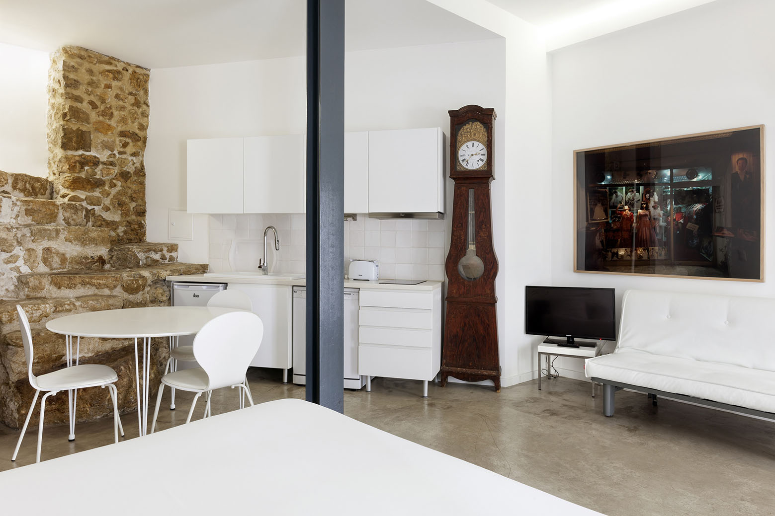 Studio Apartment with Stone Wall