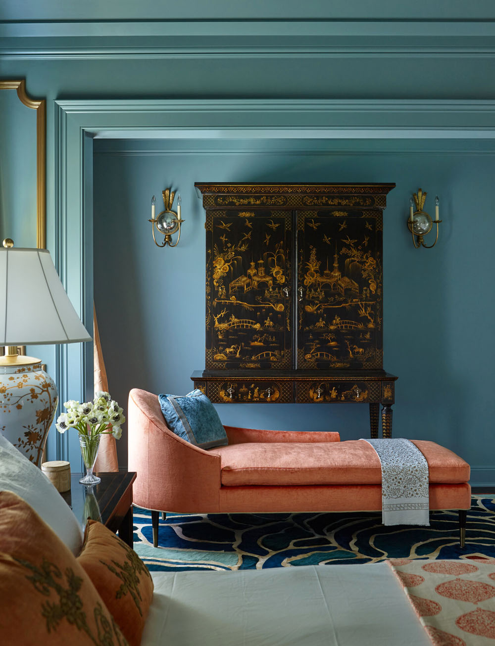 Orange Velvet Chaise Lounge and Blue Wall