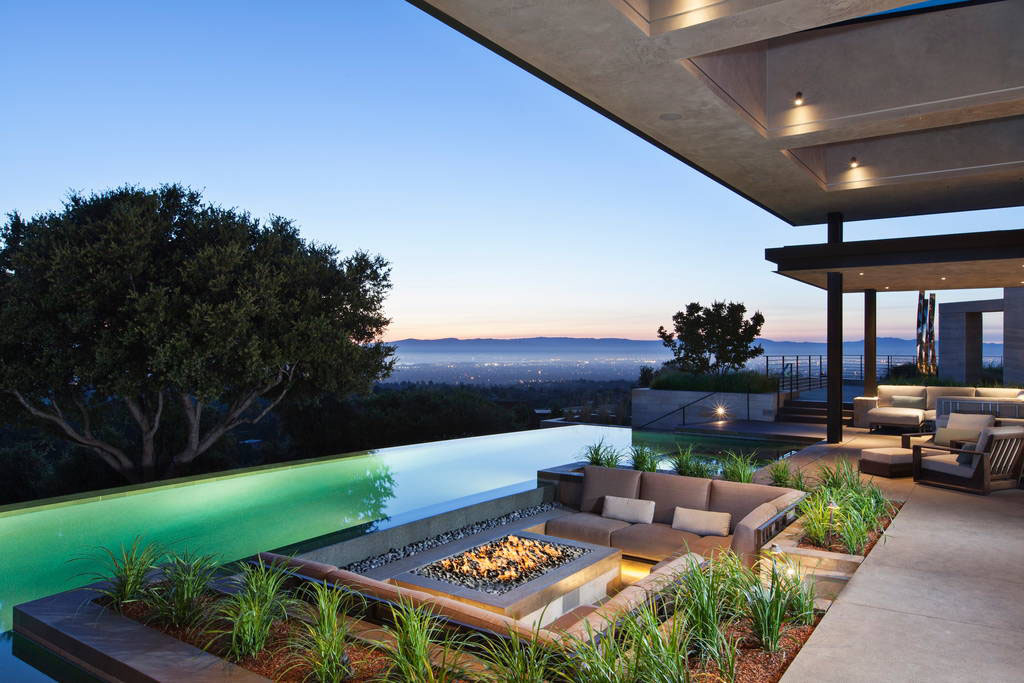 Outdoor entertaining space with fire pit and swimming pool