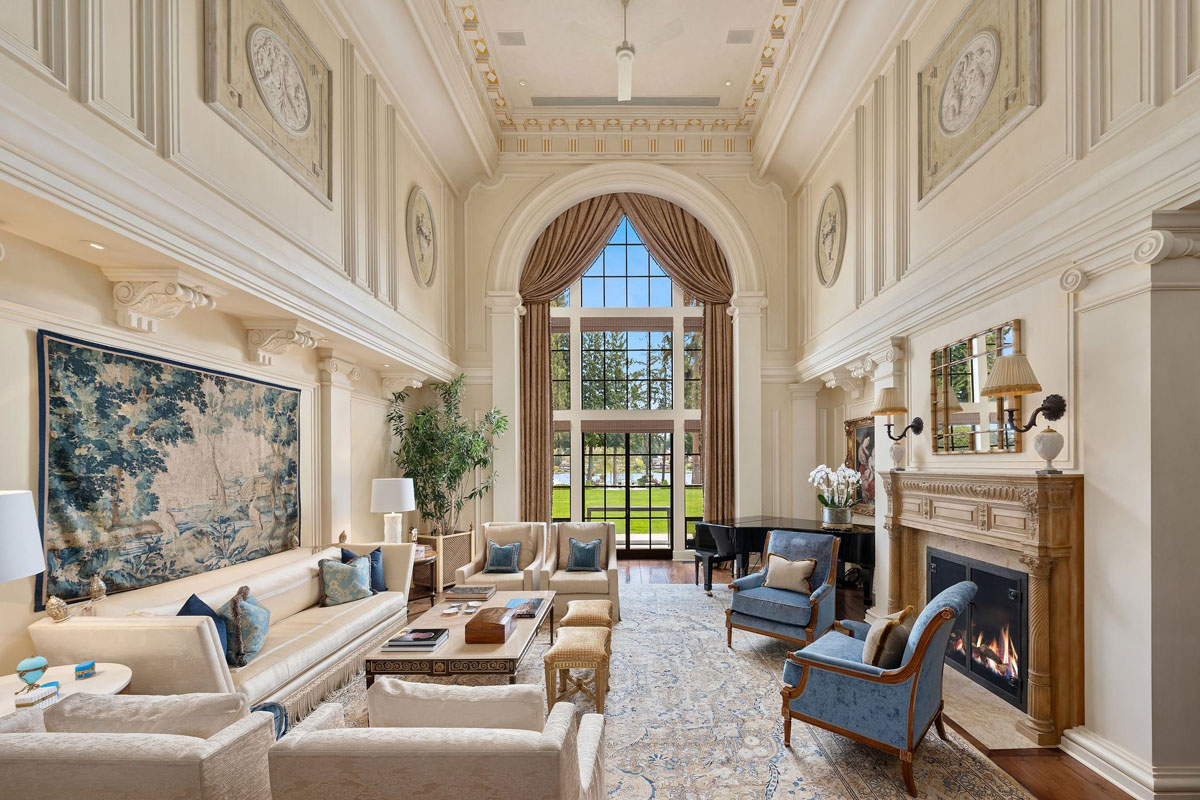 Double Height Living Room with Large window Framed by a Classical Arch