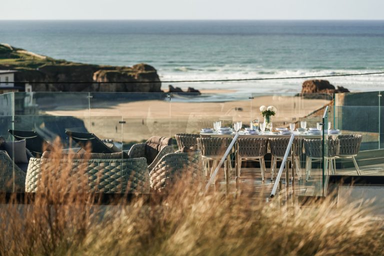 Dramatic Modern Stone Beach House with Glass Façade