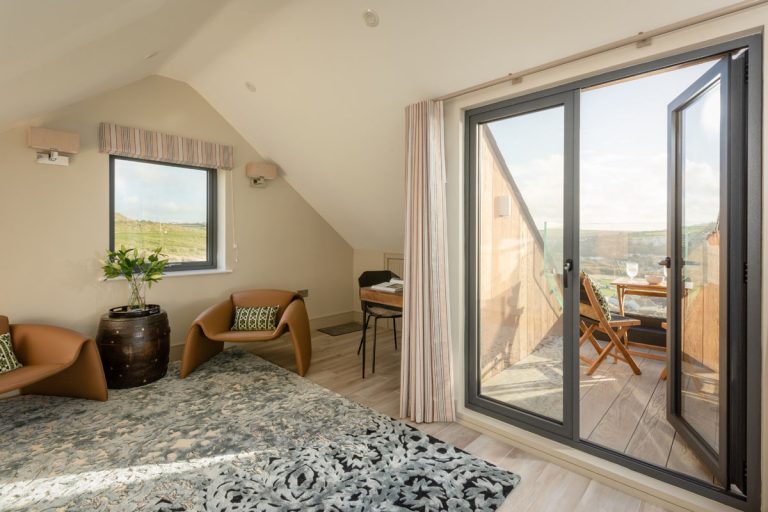 Dramatic Modern Stone Beach House with Glass Façade