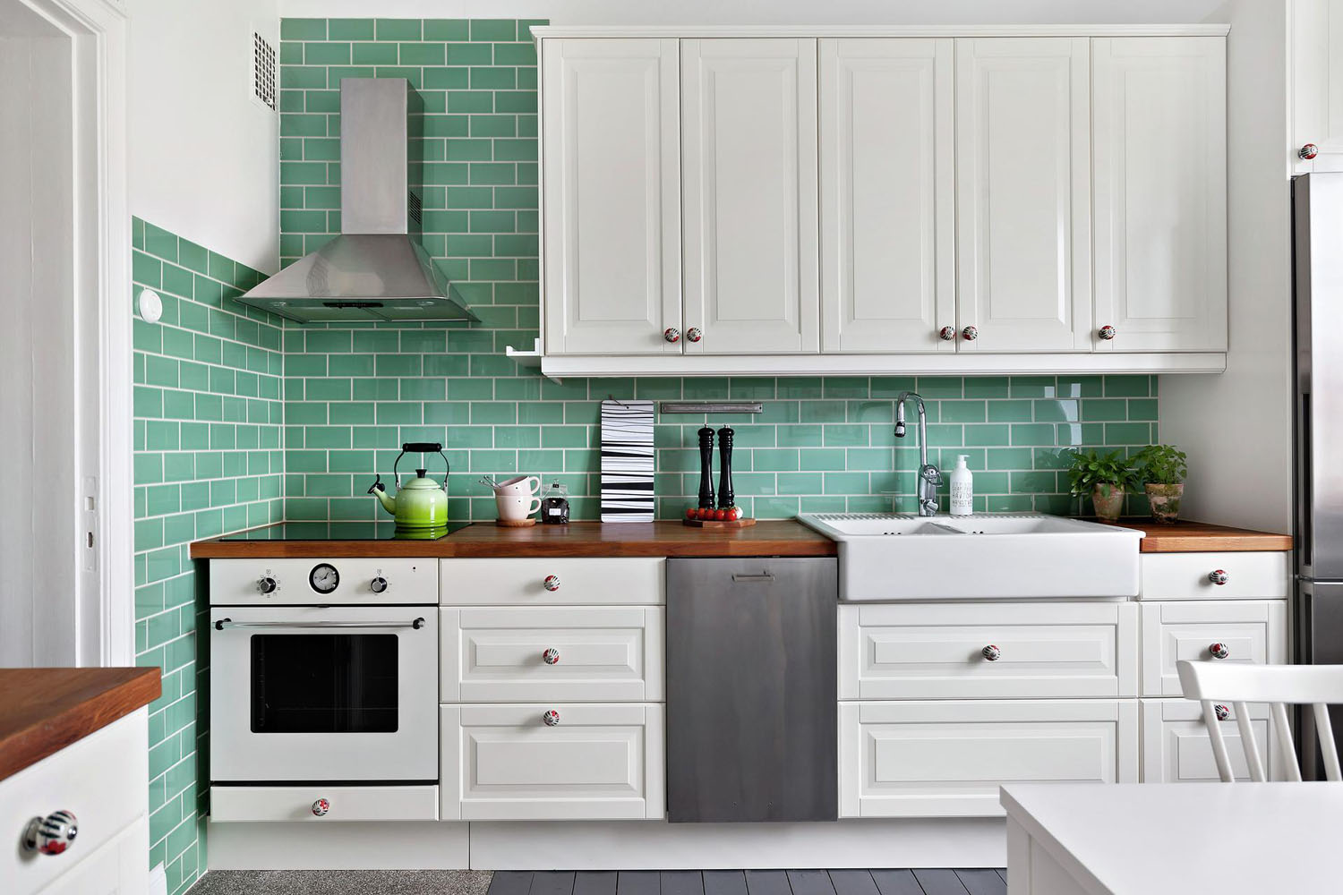White IKEA Kitchen with Green Tiles