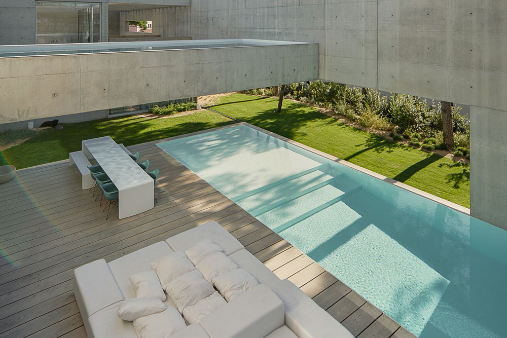 Modern Concrete House With Spiral Staircase And Two Outdoor Pools