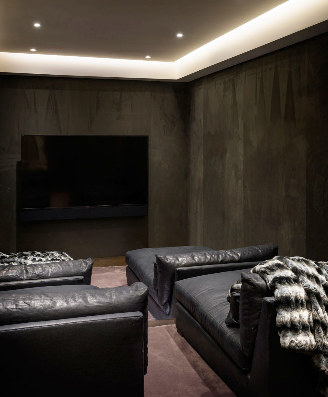 Home Theater with Black Leather Sofas