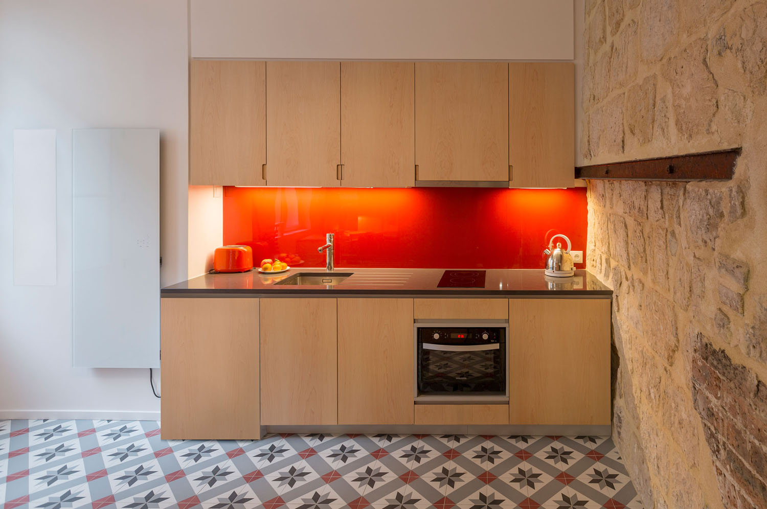 Modern Kitchen with Stone Wall