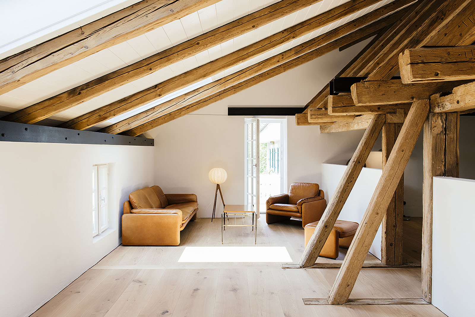 Renovated Attic Space with Exposed Wood Beams