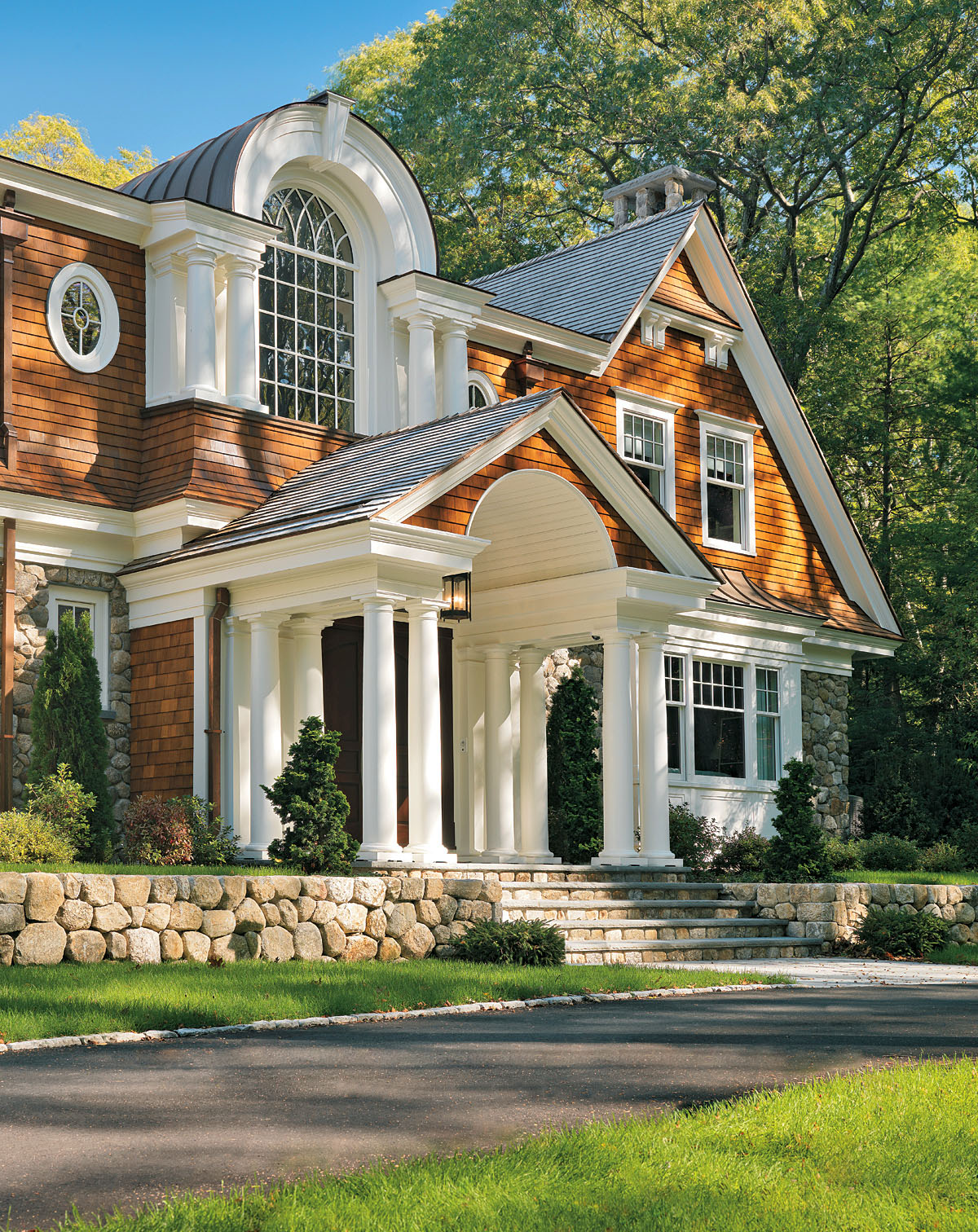 Front Entry Portico with Classical Columns and Arches