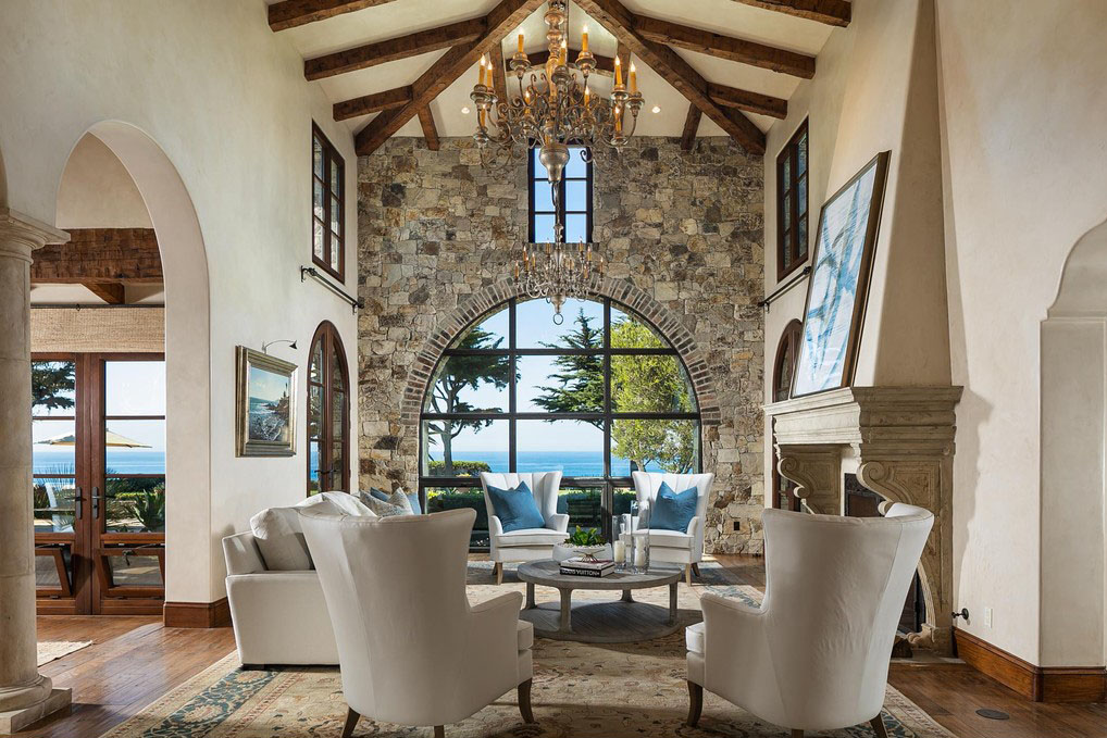 Living Room with Large Arched Window and Cathedral Vaulted Ceilings
