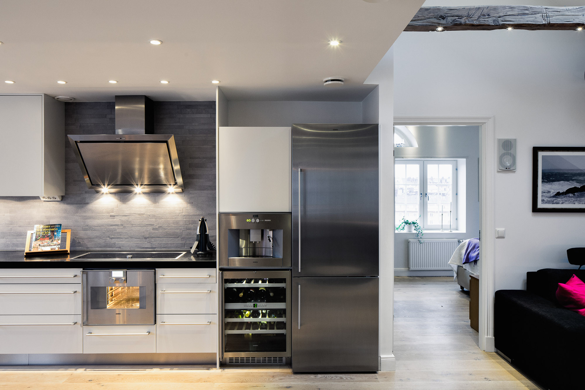 Modern White Kitchen with Stainless Steel Appliances