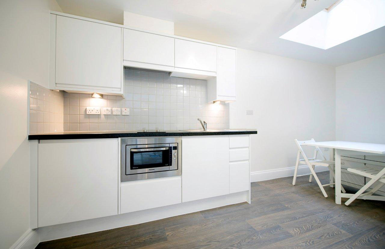 kitchen with built-in combination microwave grill oven