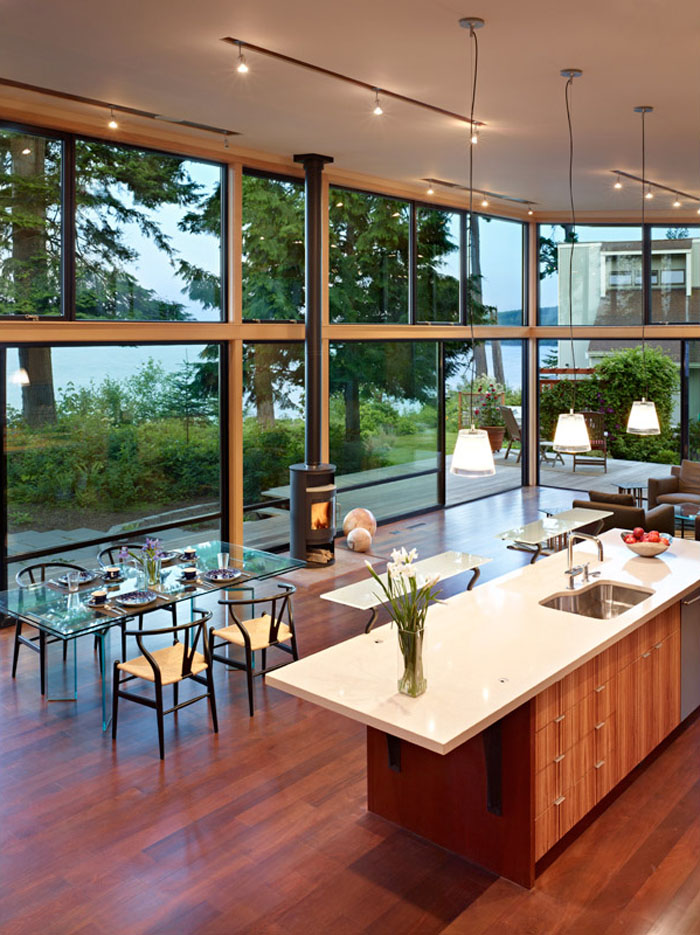 Modern Open Kitchen with High Ceiling and Water Views