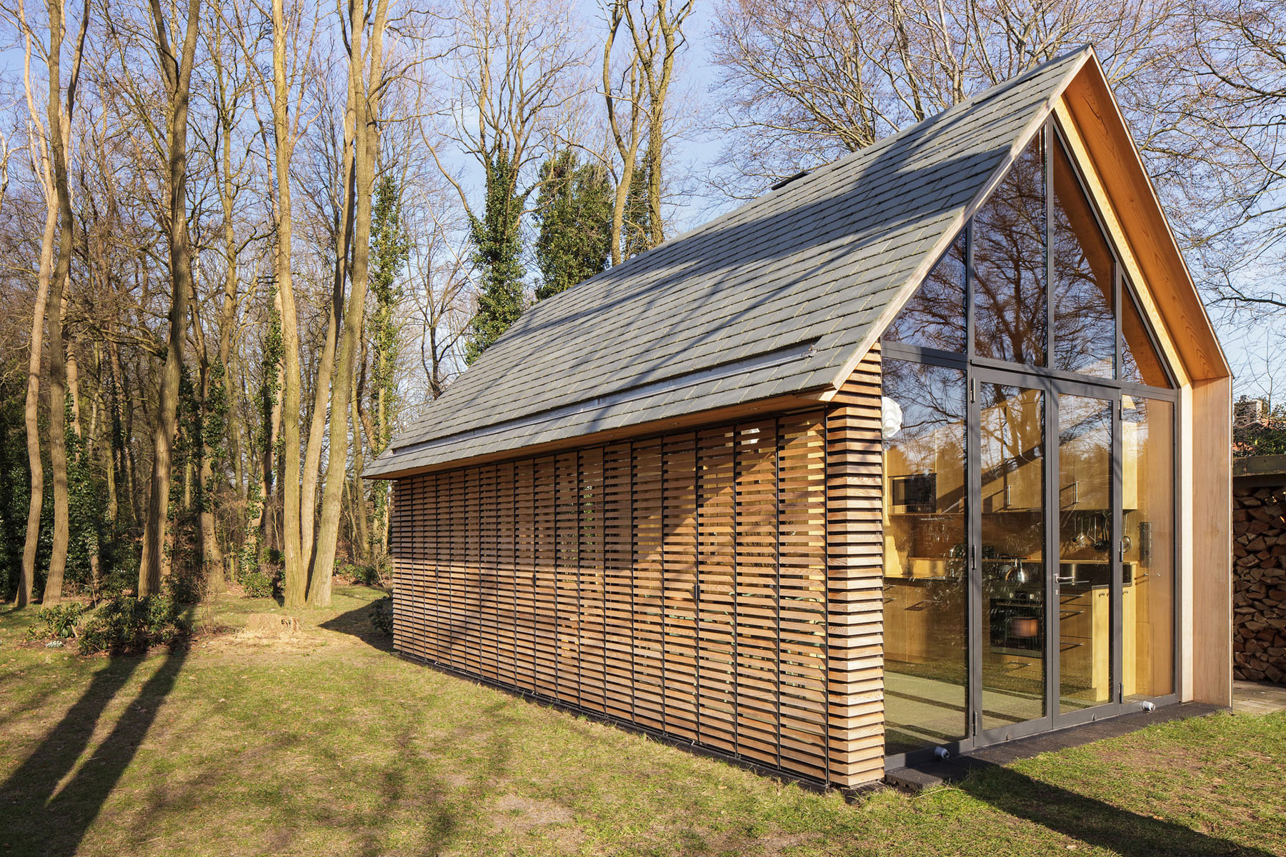 Modern Small Country Cottage With Wooden Shutters In The