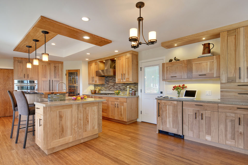 contemporary kitchen with quartz countertops and red birch cabinets