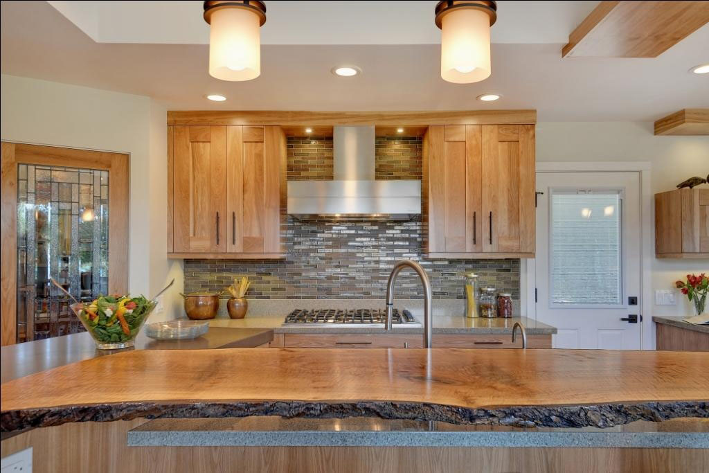 contemporary kitchen with quartz countertops and red birch cabinets