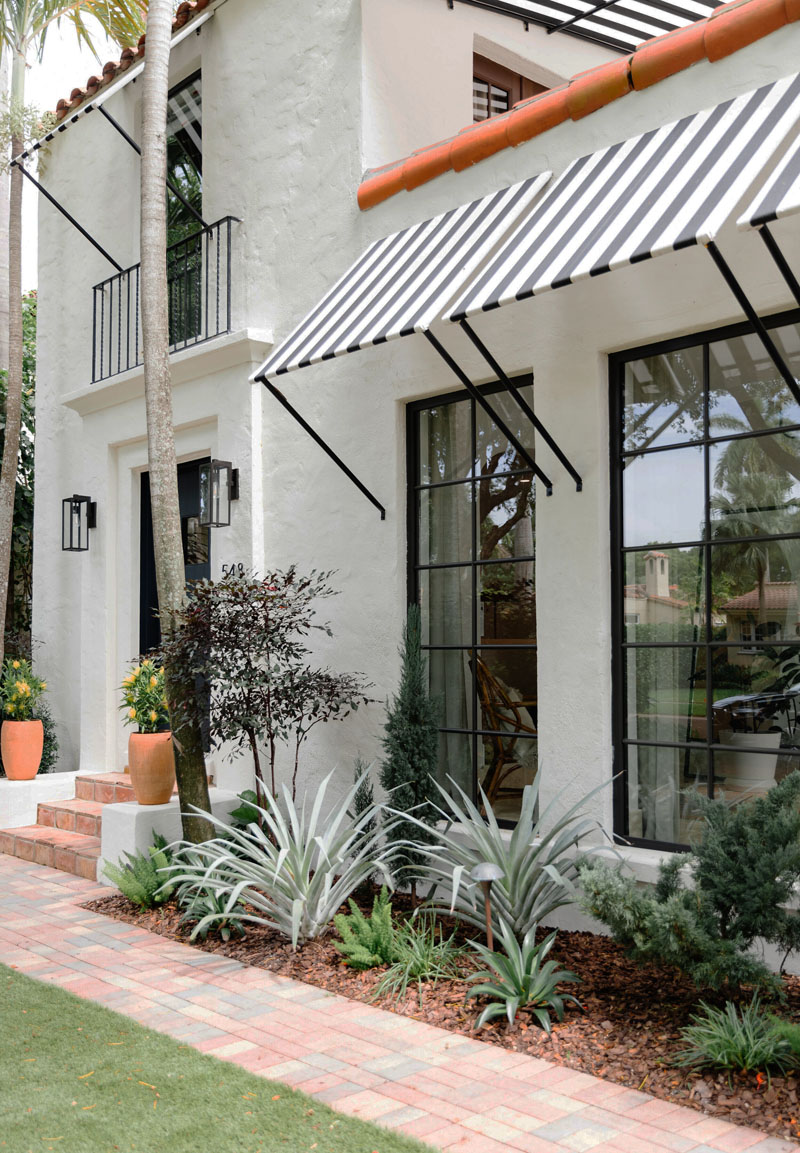 Spanish Style House with Striped Awnings