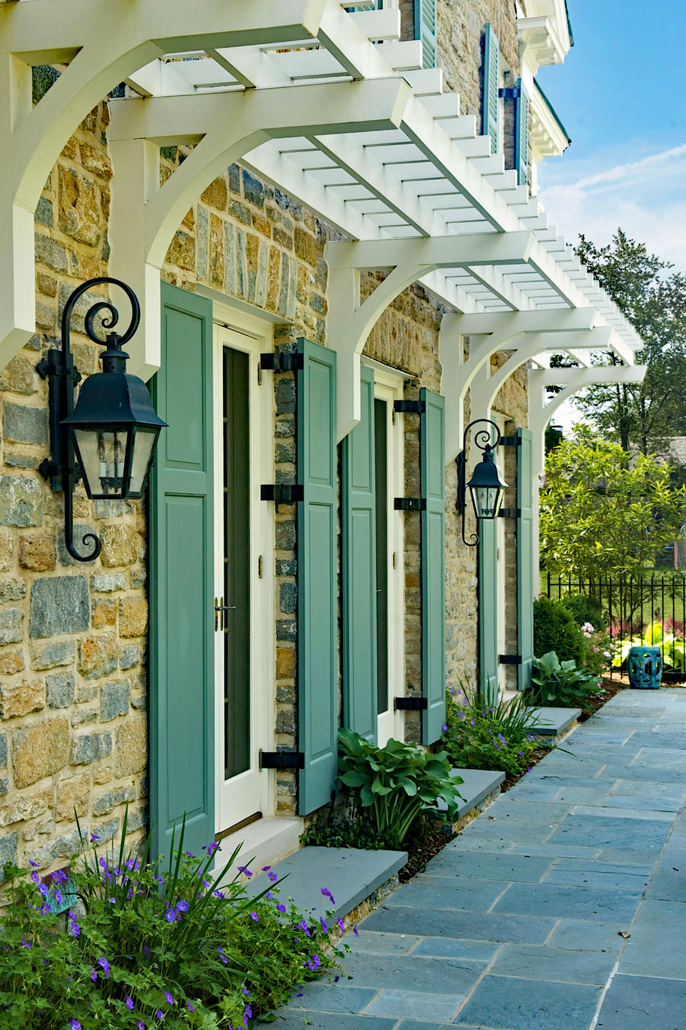 Stone House with Green Shutters