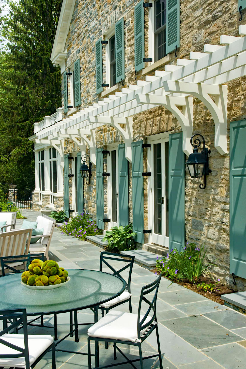 Stone House with Green Shutters