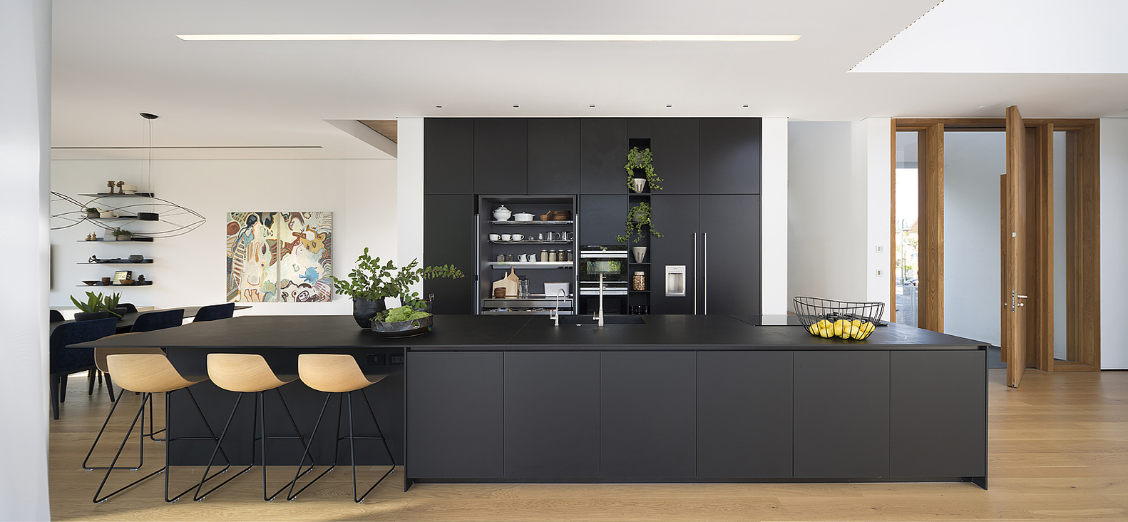Modern Kitchen with Black Cabinets and Black Countertop