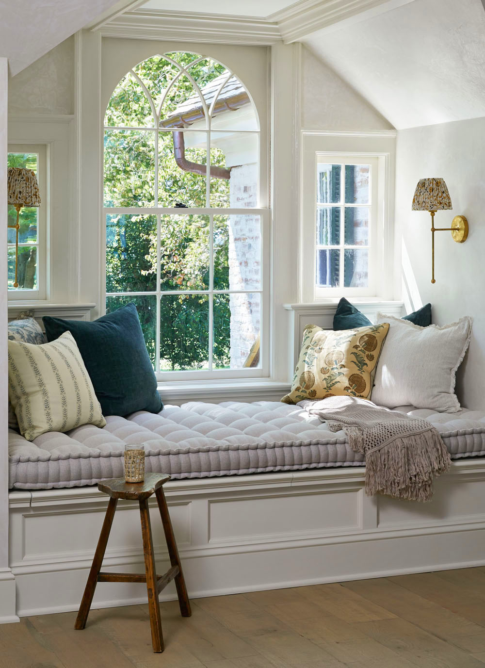 Cozy Sitting Nook with Arched Window and Seating Bench