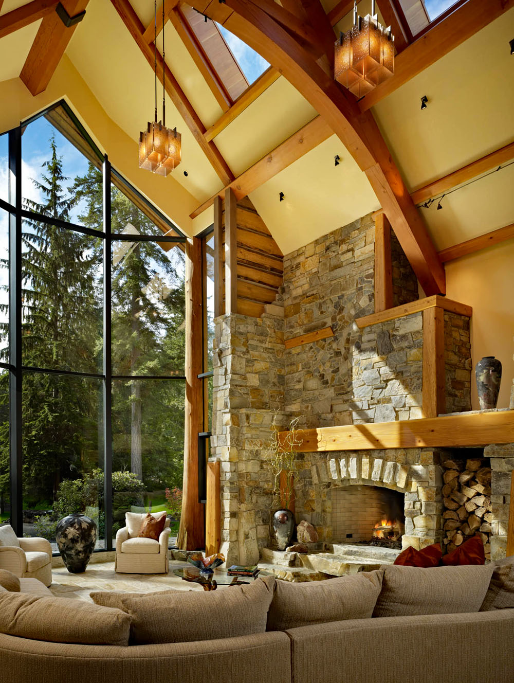 Double Height Main Living Room with Stone Fireplace and Wood Trusses