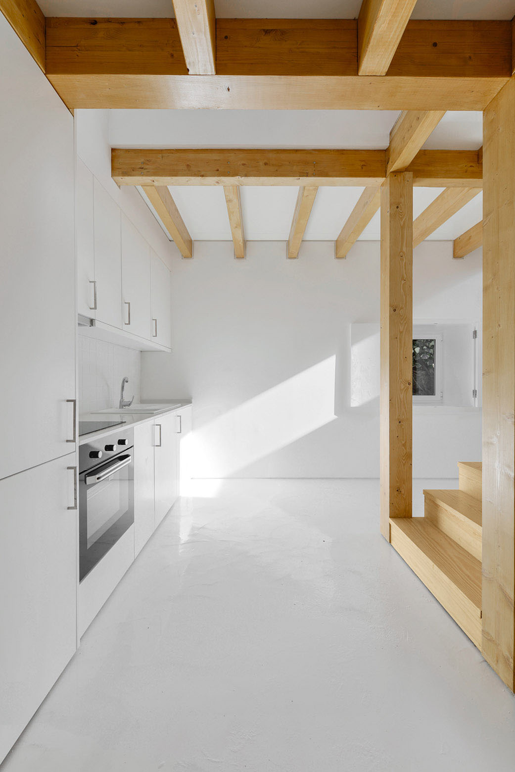 White Minimalist Kitchen with Wood Beams