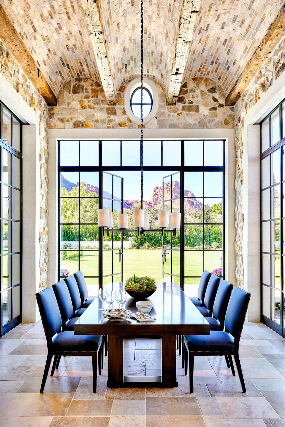 Conservatory Dining Room with Brick Barrel Vault Ceiling and Steel Doors