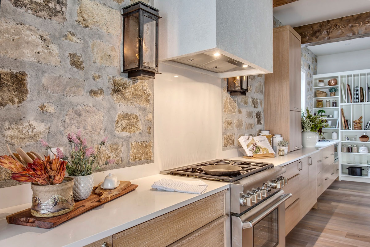 Rustic Modern Kitchen with Stone Walls and Quartz Countertops