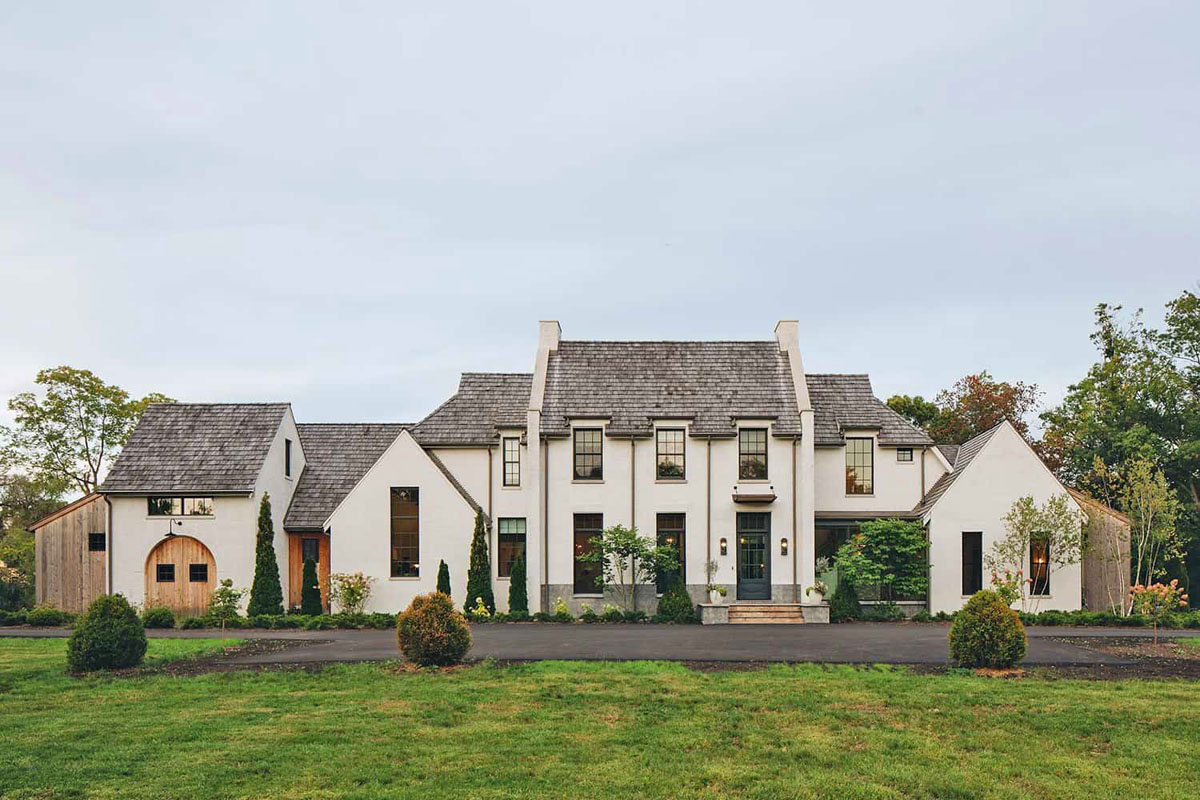 Home Exterior with White Brick and Cedar Shake Roof