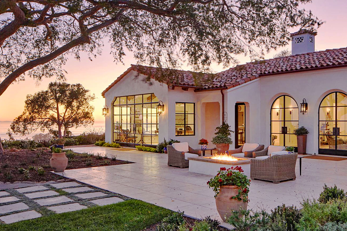 Spanish Colonial Revival Style Villa with Unsurpassed Views Nestled in the hills, this stunning Spanish Colonial Revival style villa boasts unparalleled views of the surrounding landscape. With its red tile roof, arched doorways, and ornate ironwork, this home exudes elegance and charm, offering a perfect blend of old-world craftsmanship and modern luxury.